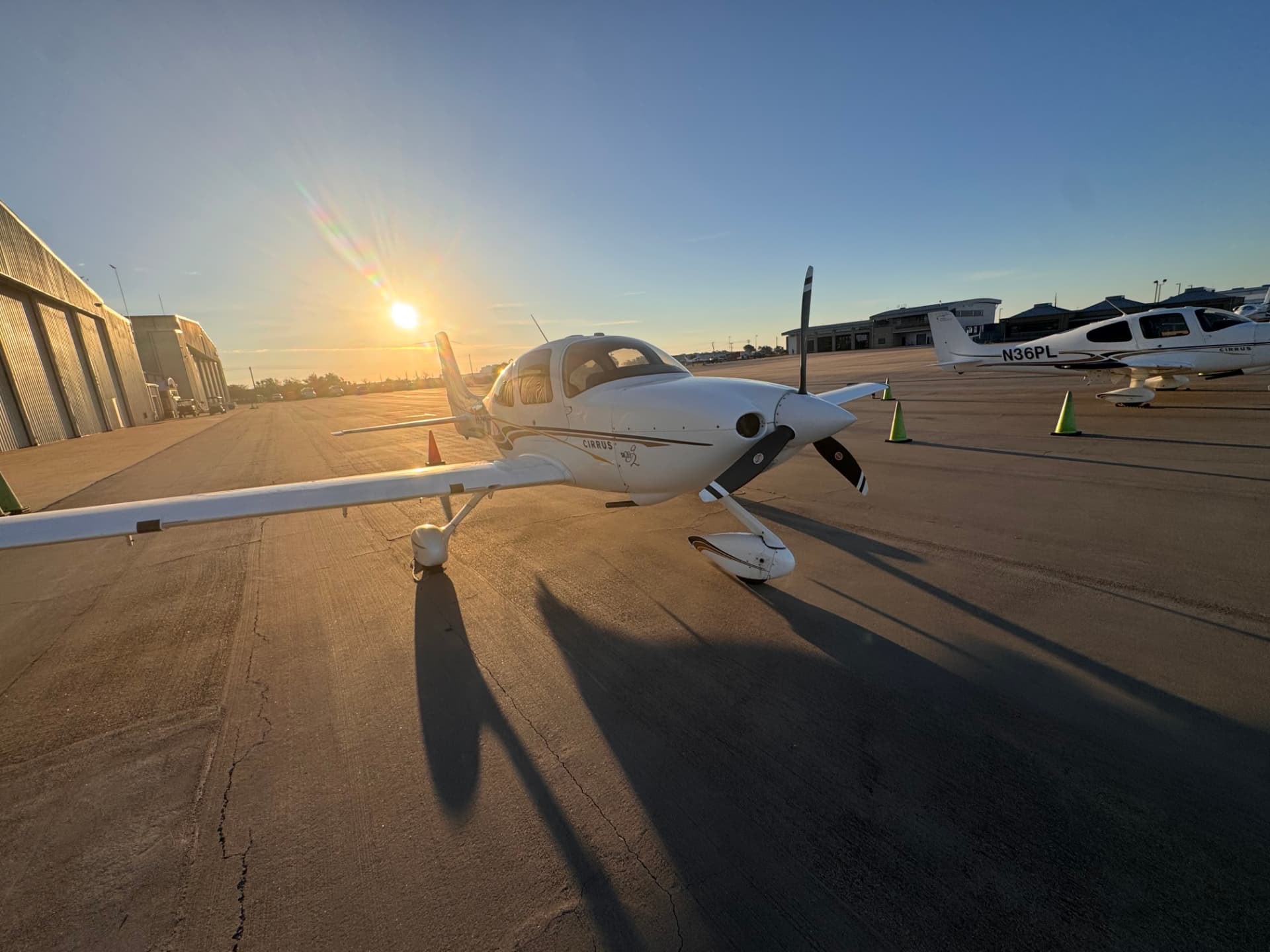 A4Flight Cirrus aircraft on the Denton ramp at sunset