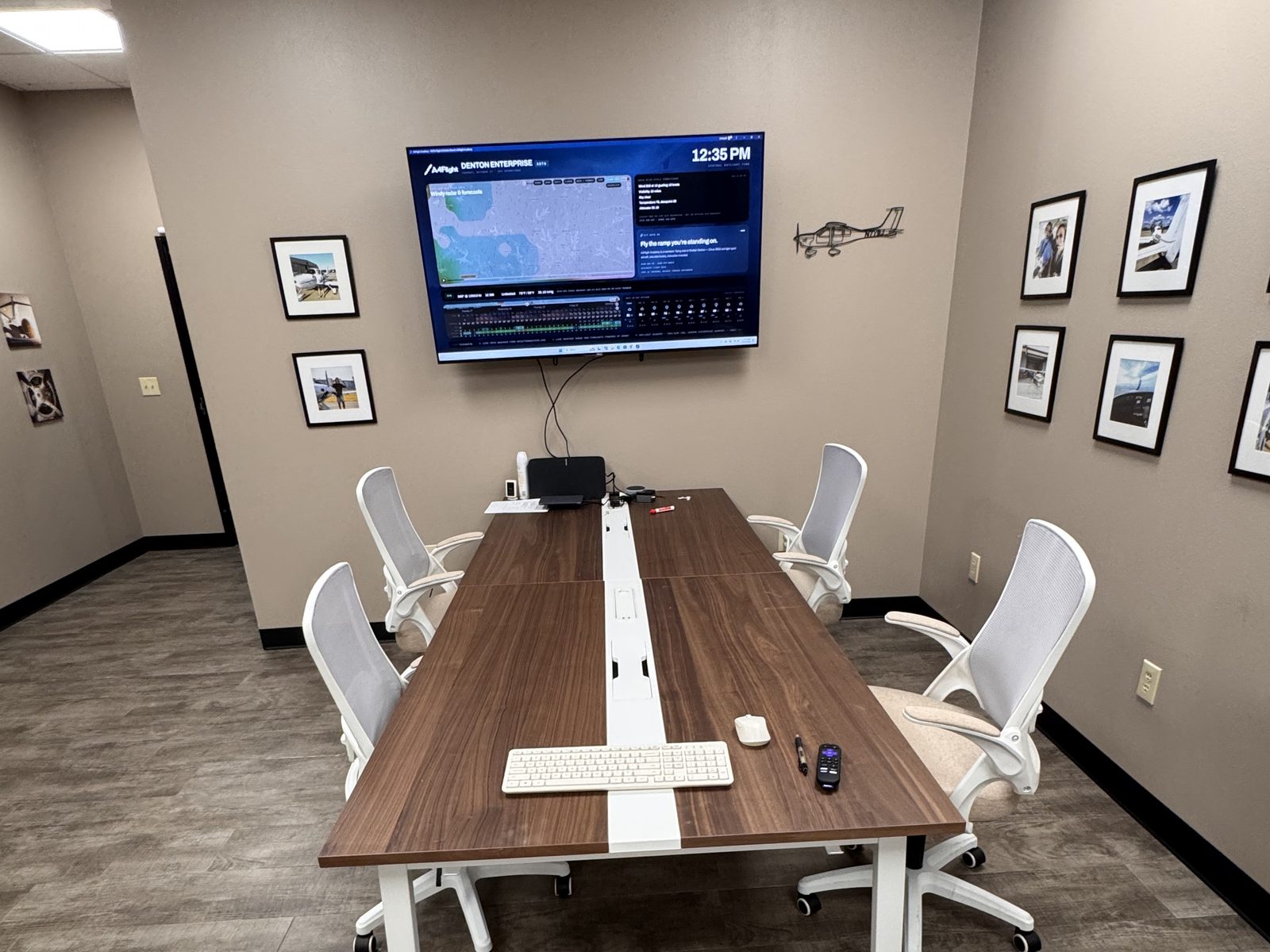 Looking down the A4Flight briefing table toward the flight board, with chairs set for a lesson.