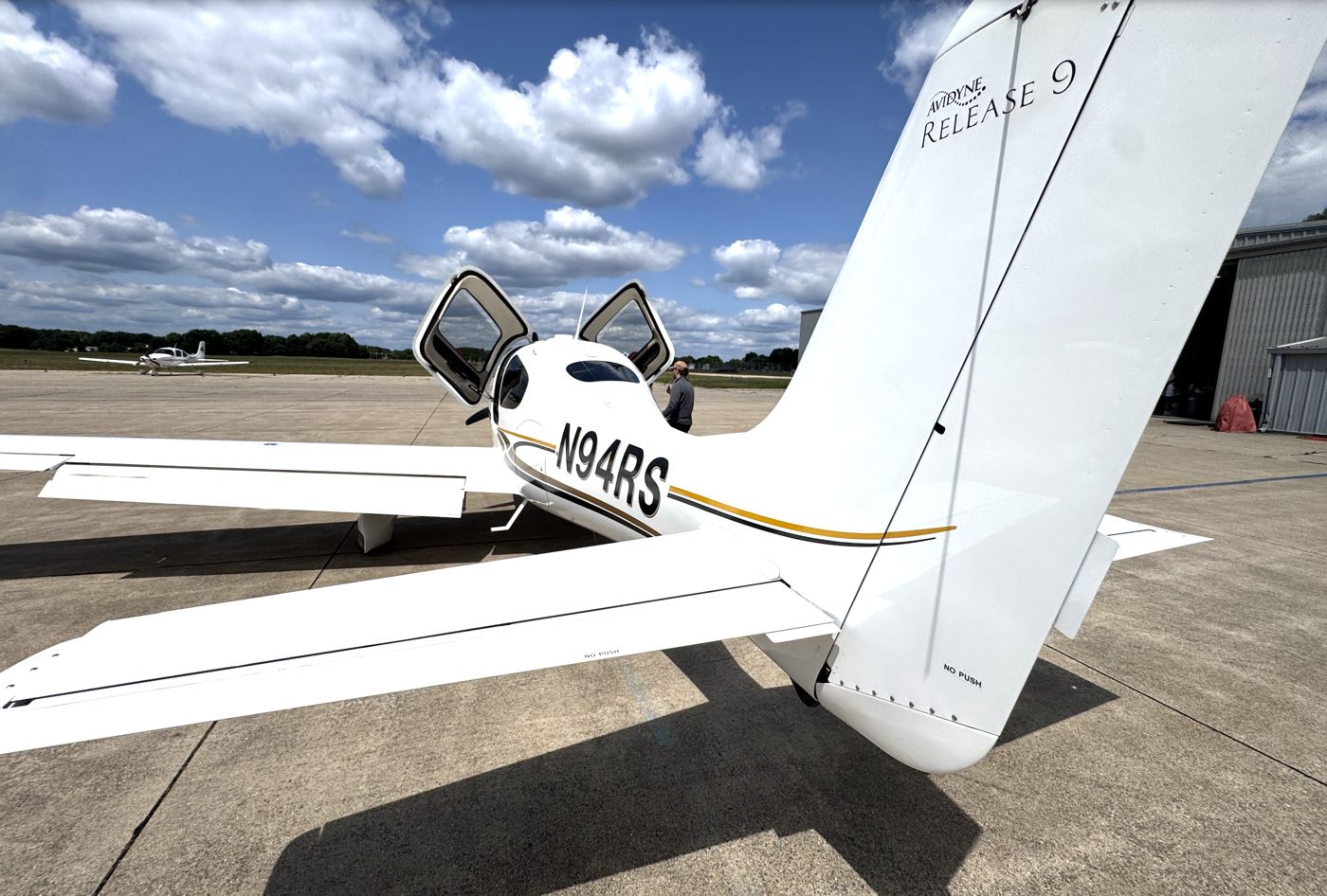 Cirrus SR20 N94RS with the cabin door open on the ramp