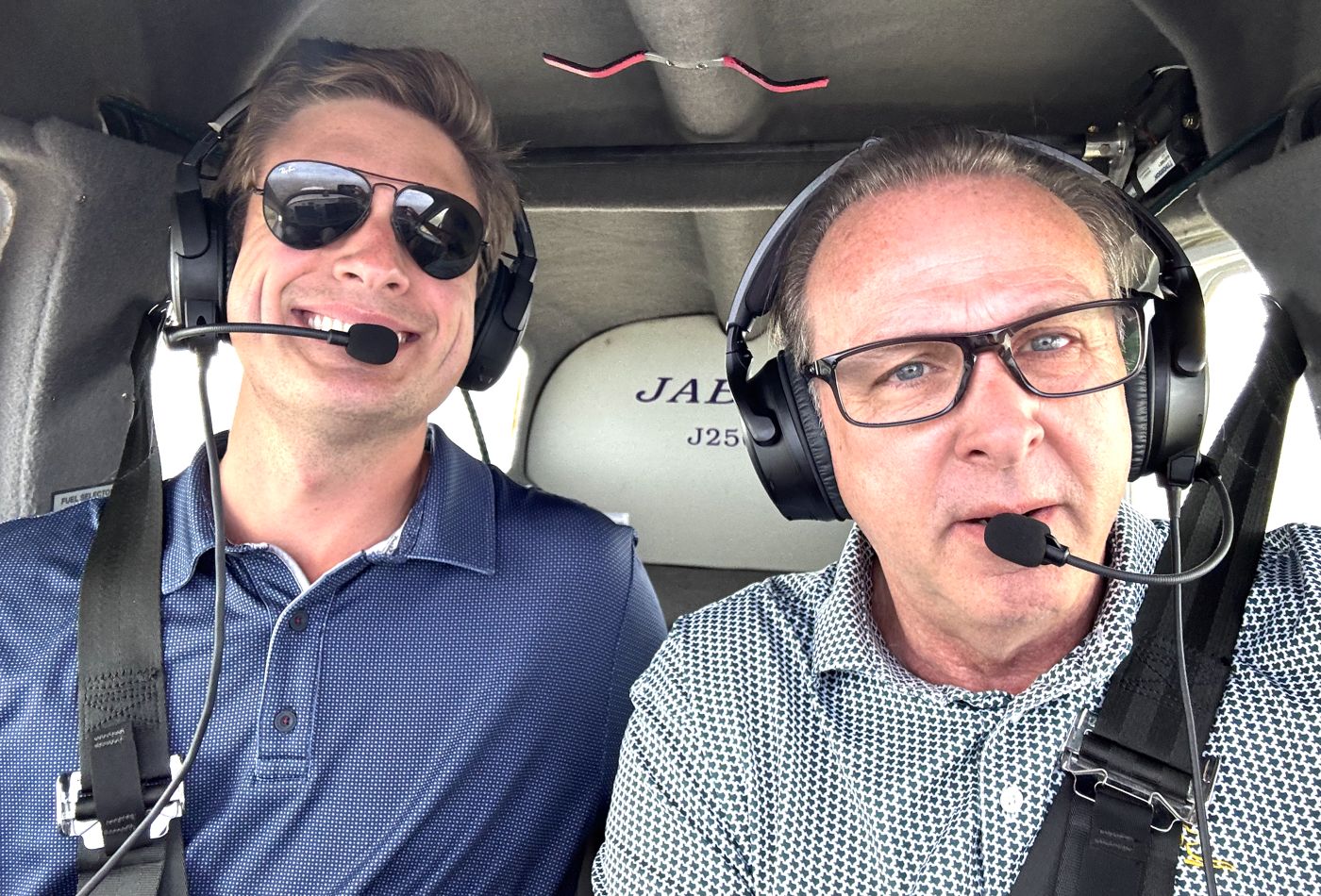 Two pilots wearing headsets in the Jabiru cockpit